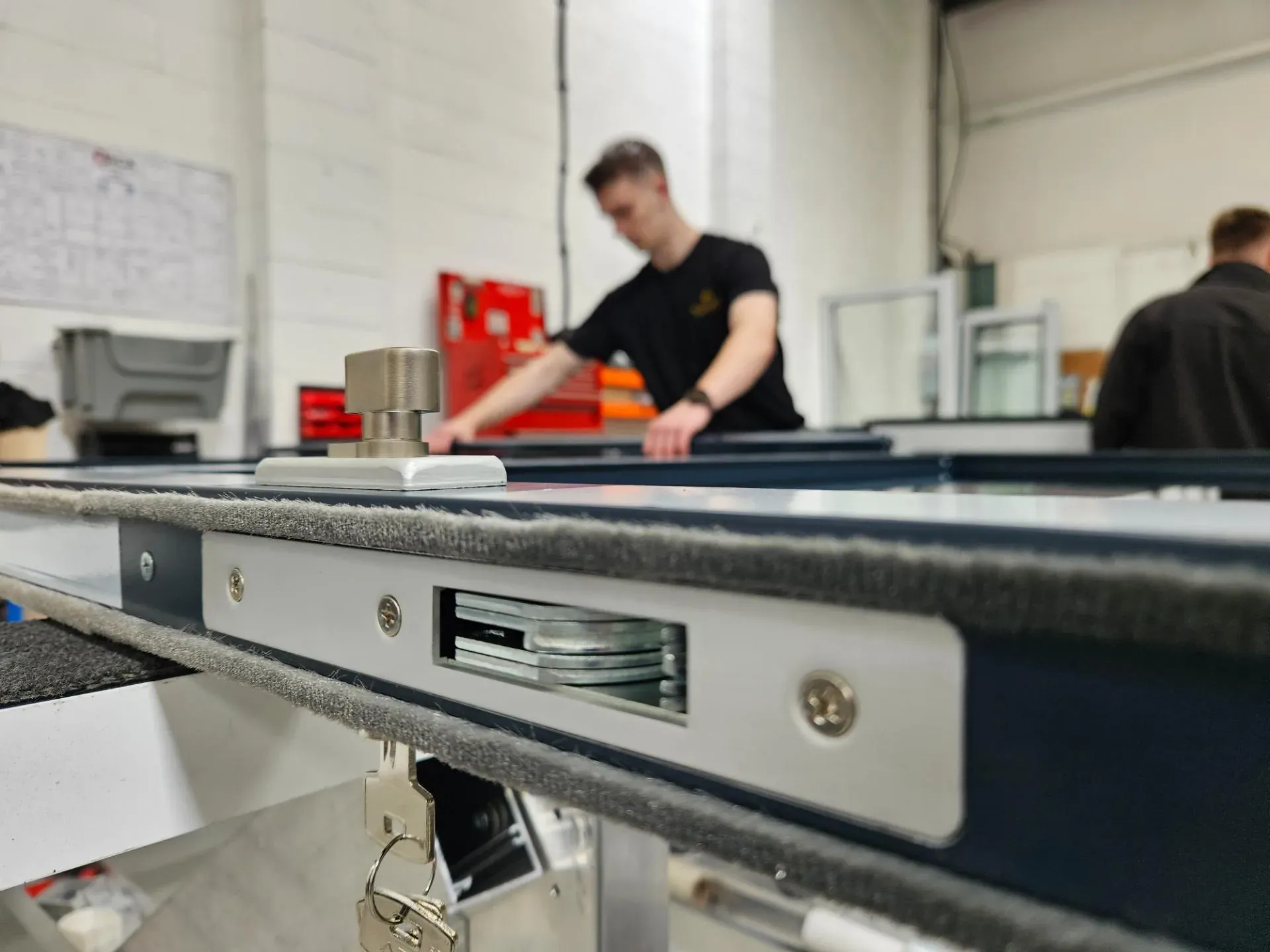 Commercial aluminium door being assembled in the Kingsland workshop