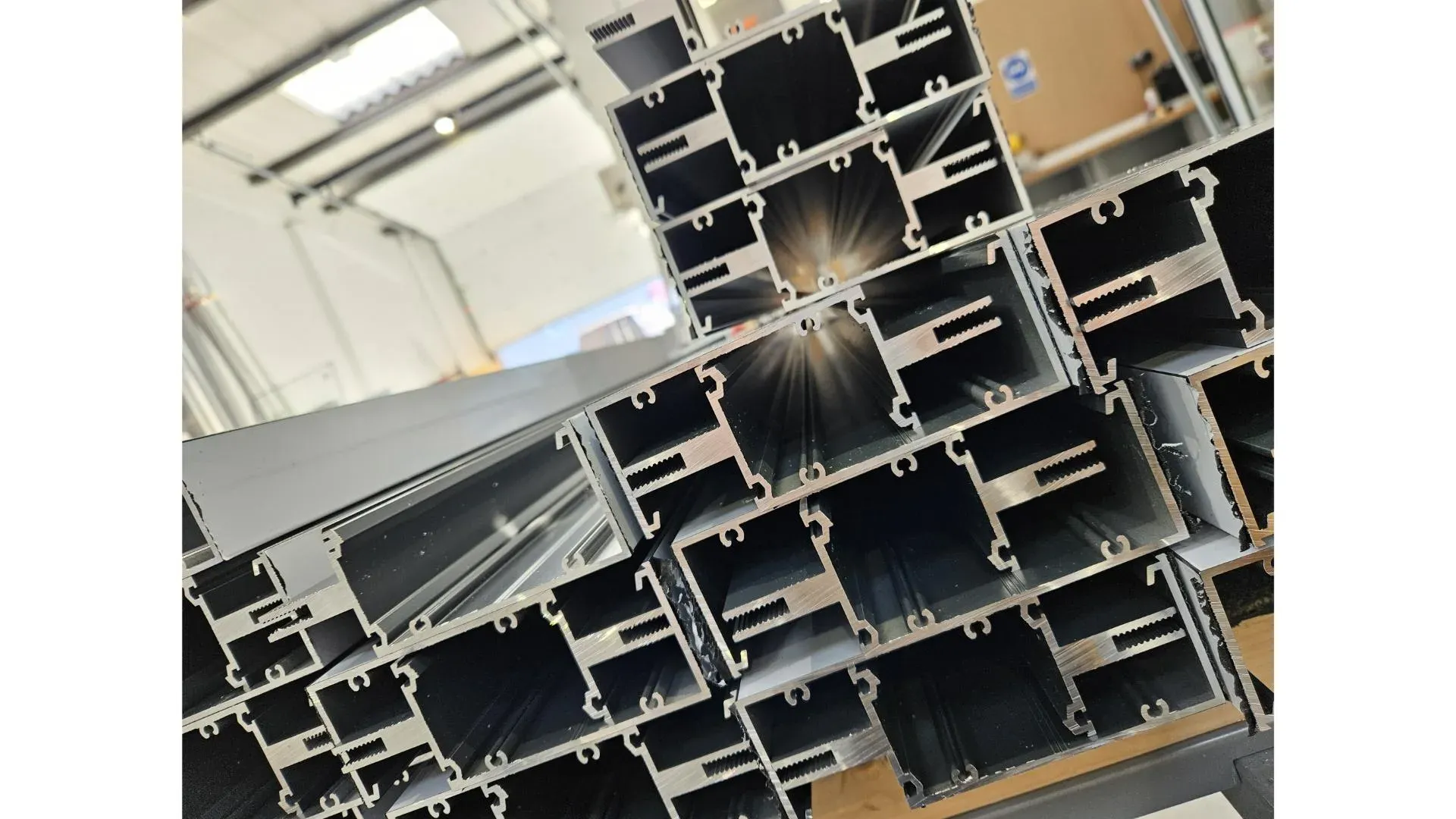 Thermally broken aluminium profiles stacked and ready for fabrication