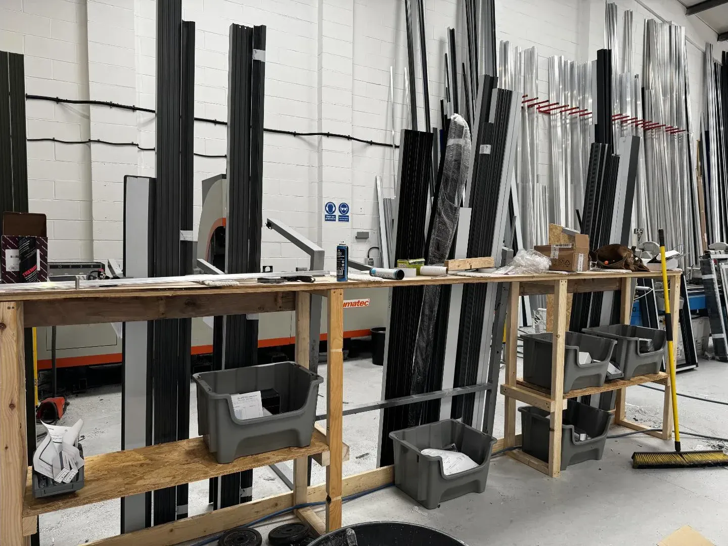 Aluminium profiles laid out on a workshop bench