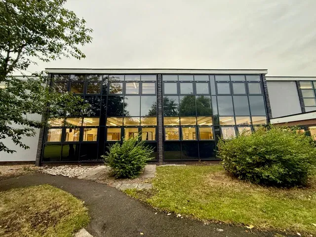 Full facade showing curtain wall screens