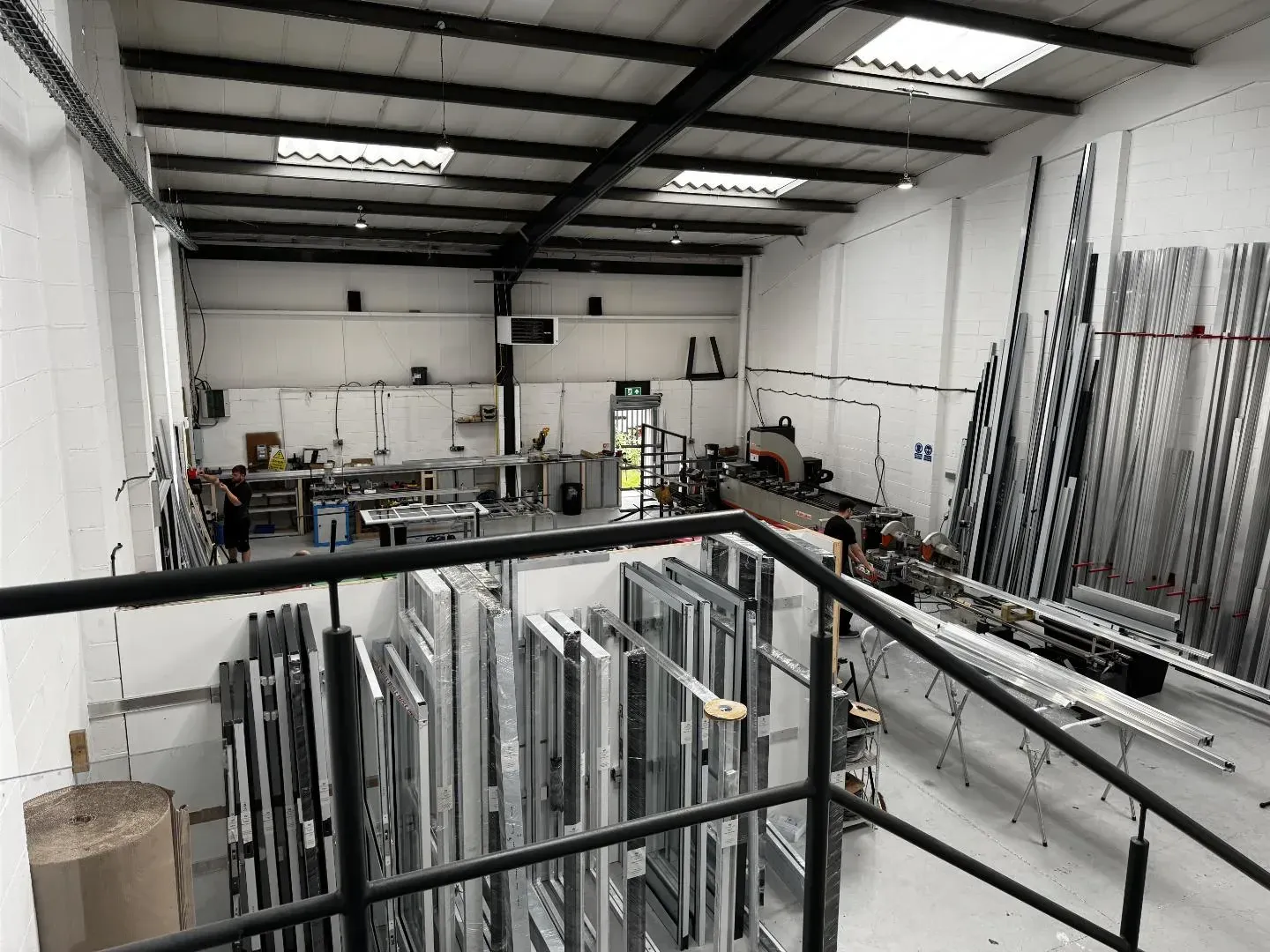 Full workshop floor view with production lines and profile storage