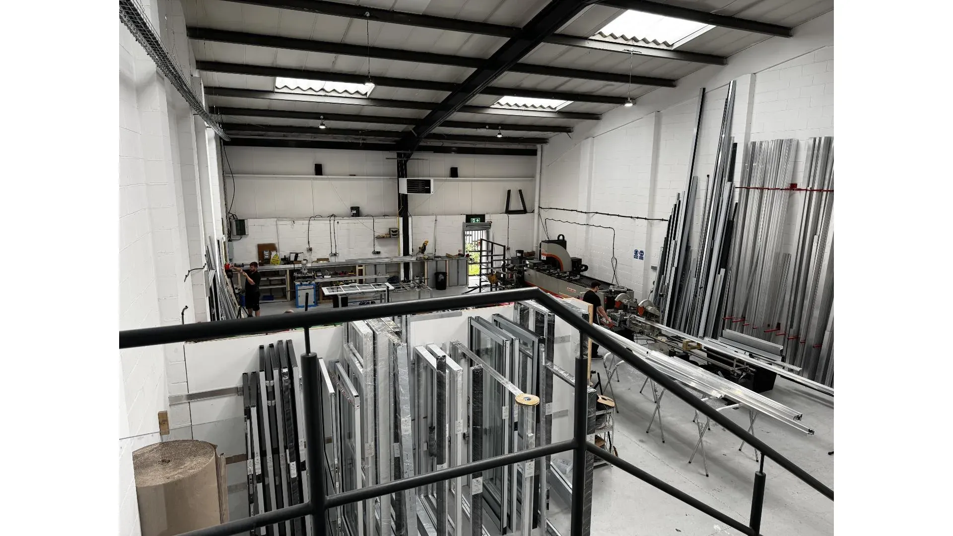 Full workshop floor view with production lines and profile storage